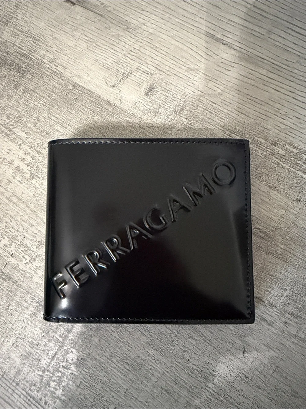 Salvatore Ferragamo Black Gloss Leather Wallet with Embossed Logo